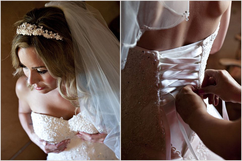 bride gets laced into wedding dress