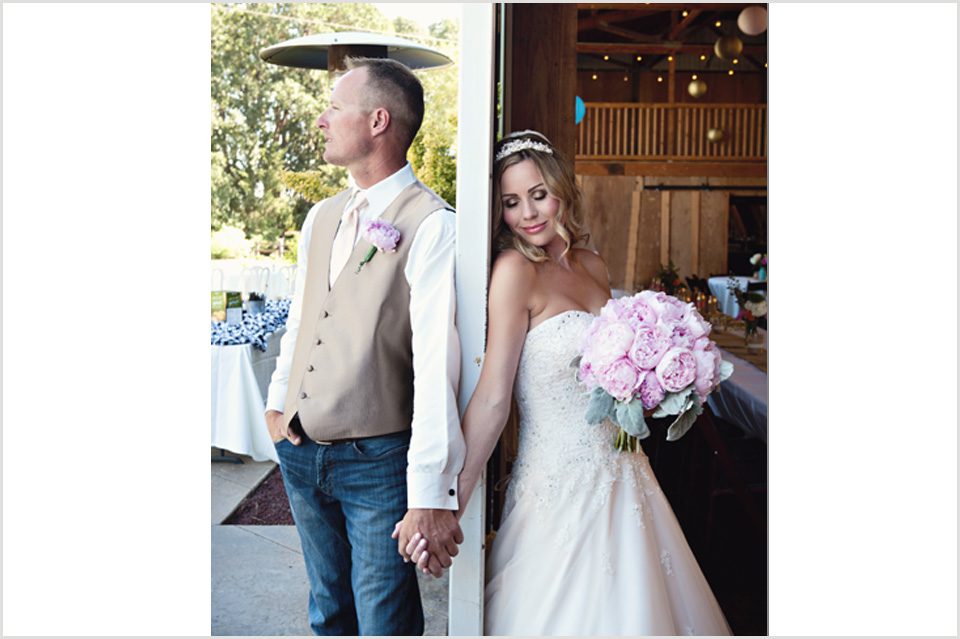 bride and groom hold hands before the wedding