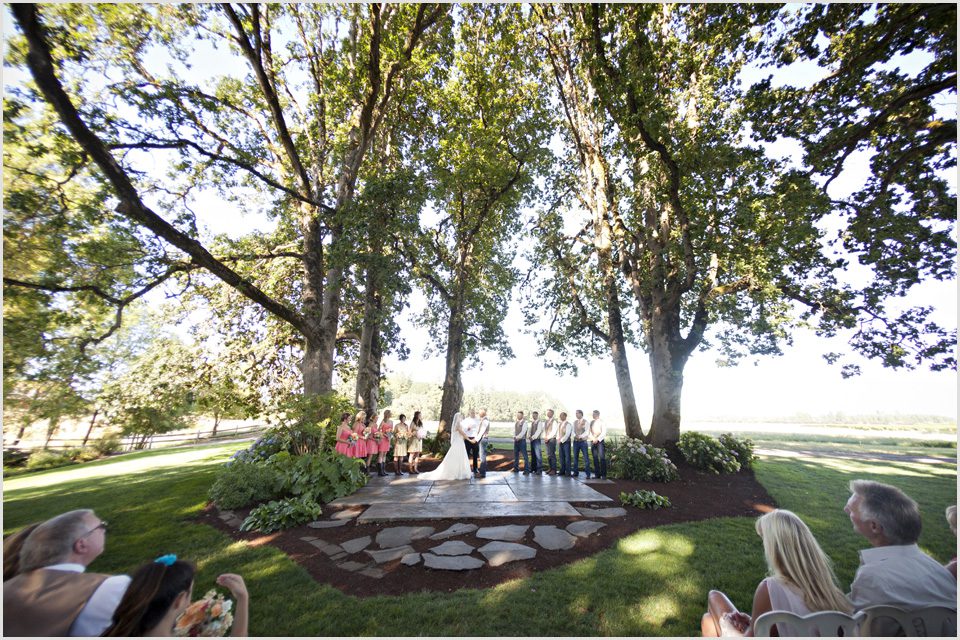 wedding ceremony held under huge trees