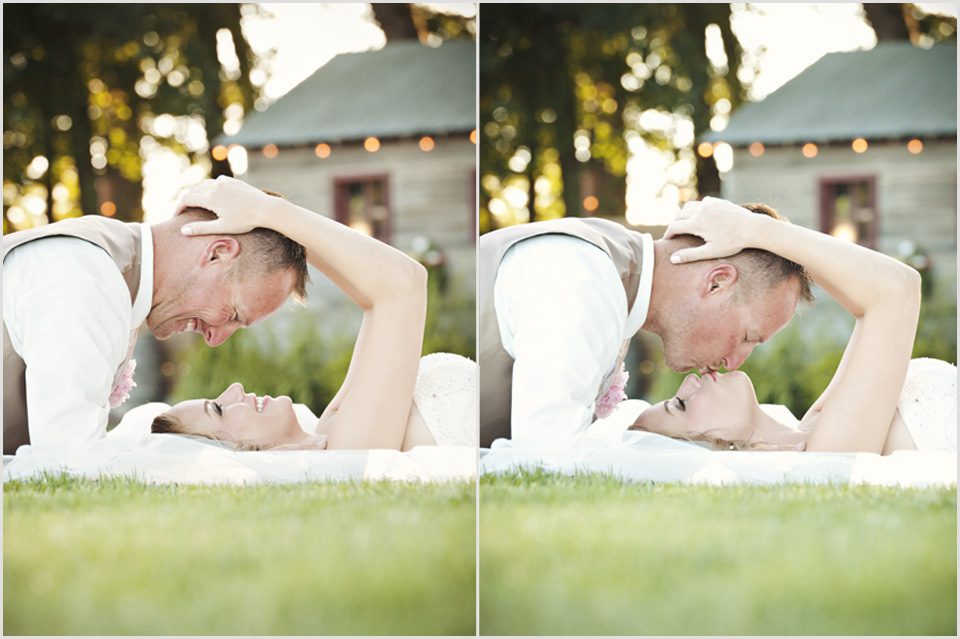 bride and groom share a kiss with bokeh lights in the background