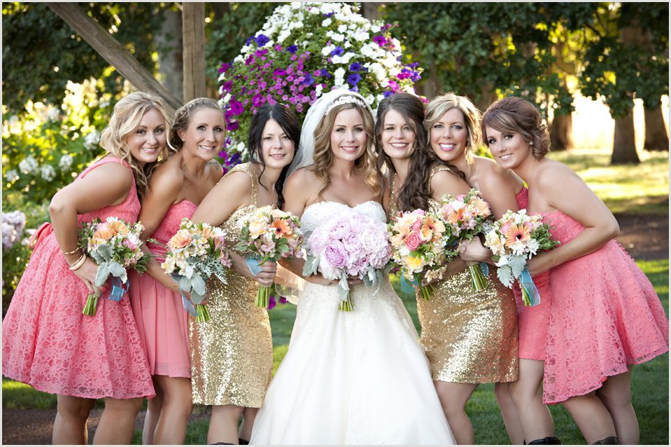 bride with her bridesmaids in pink and gold
