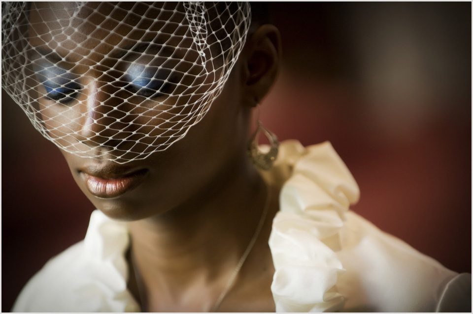 bride with blusher veil in church
