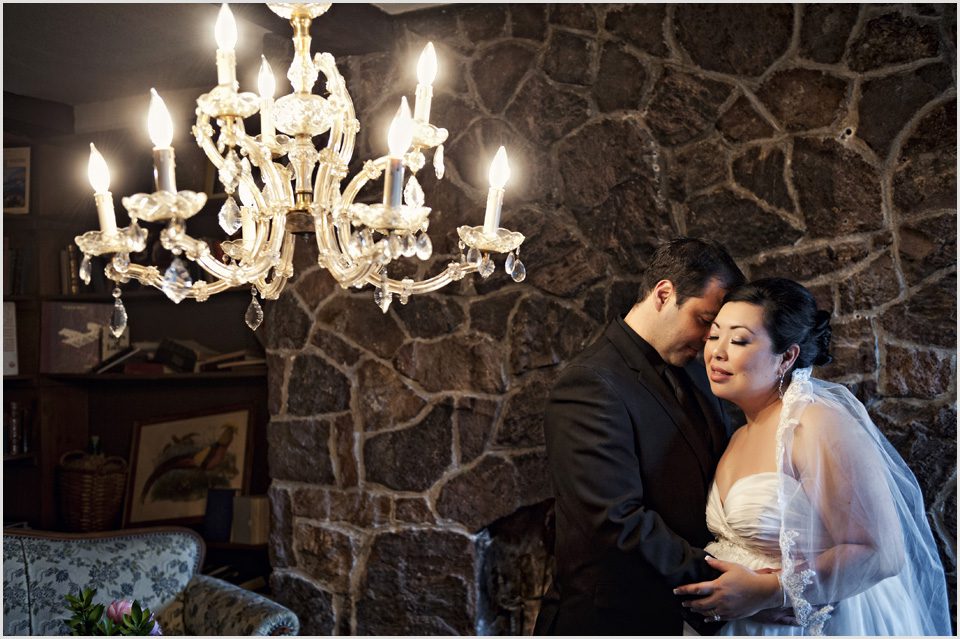 wedding photo of a bride and groom with chandelier