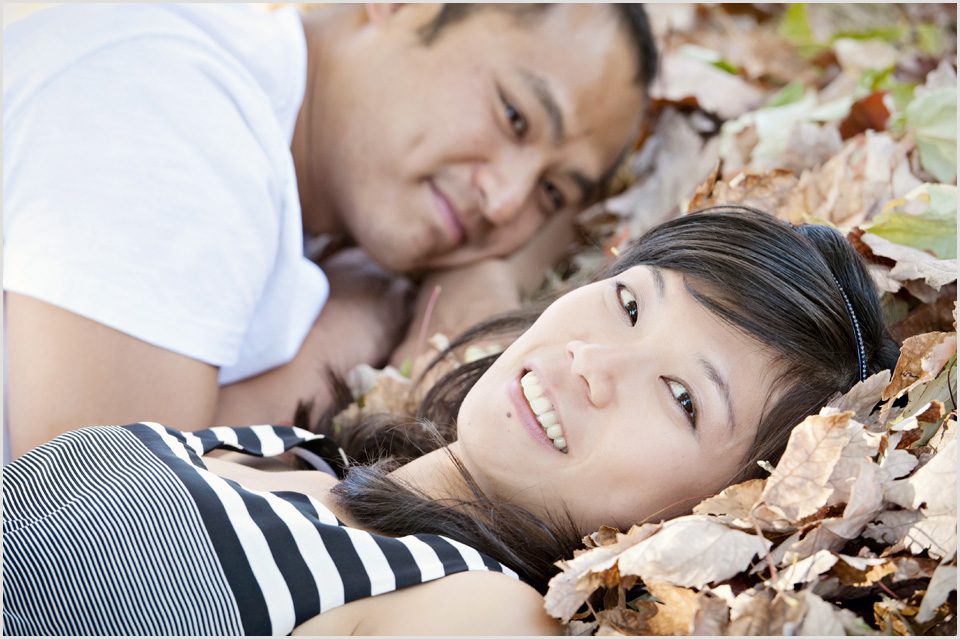 girl lays in the leaves