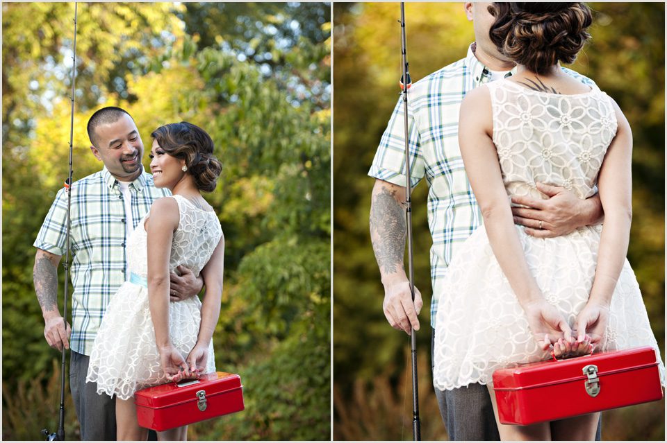 girl holds red fishing tackle box with fiancé