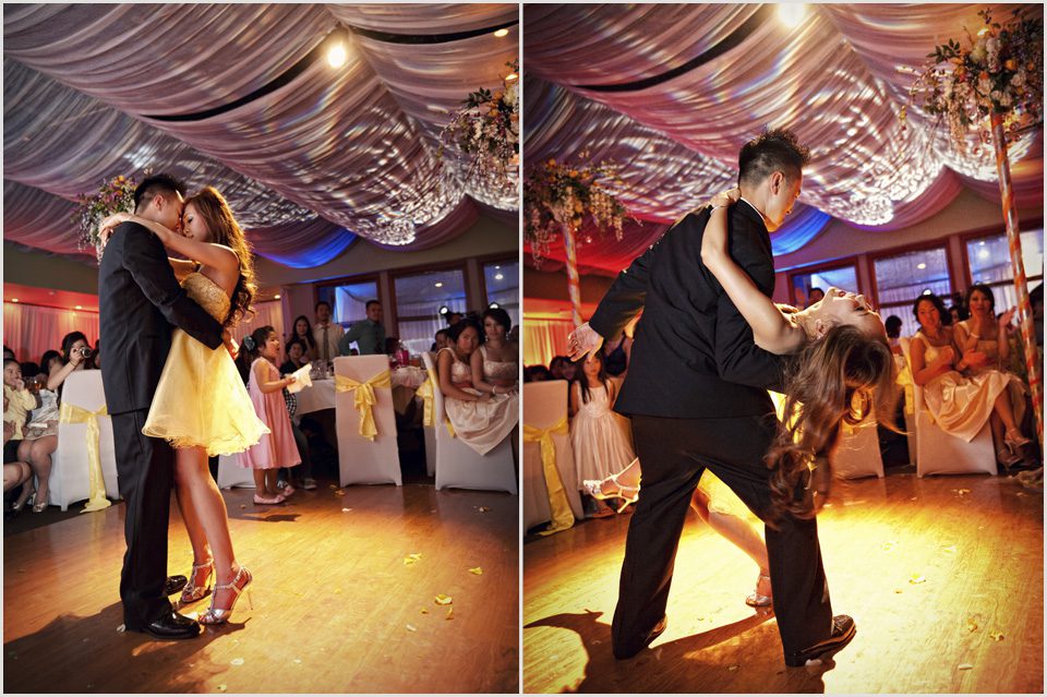 groom dips bride during their first dance together