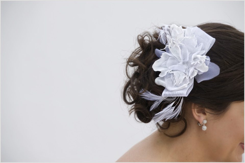 beautiful bridal hair piece with white feathers