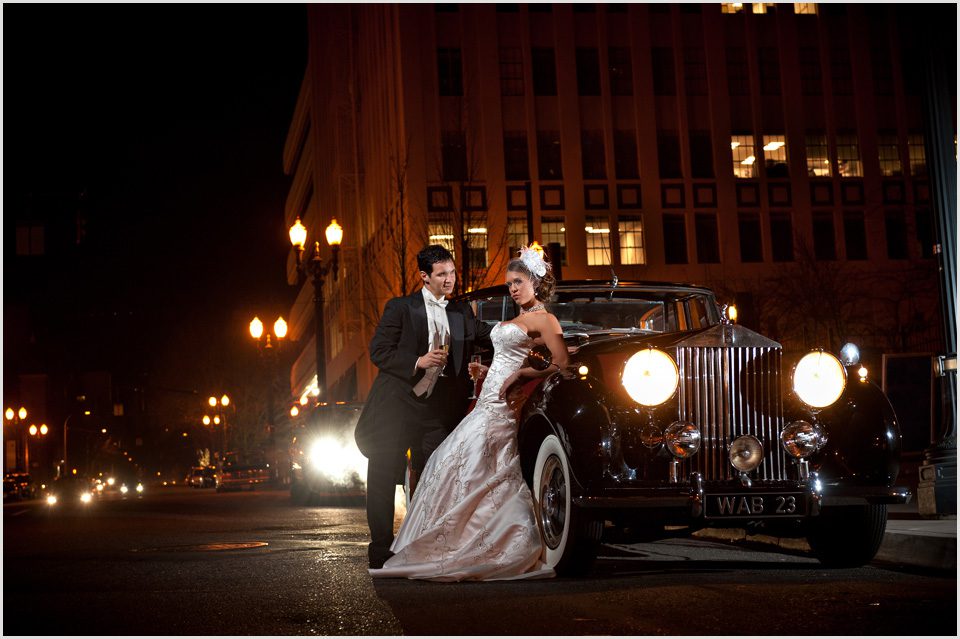 bride and groom in downtown portland with a vintage car