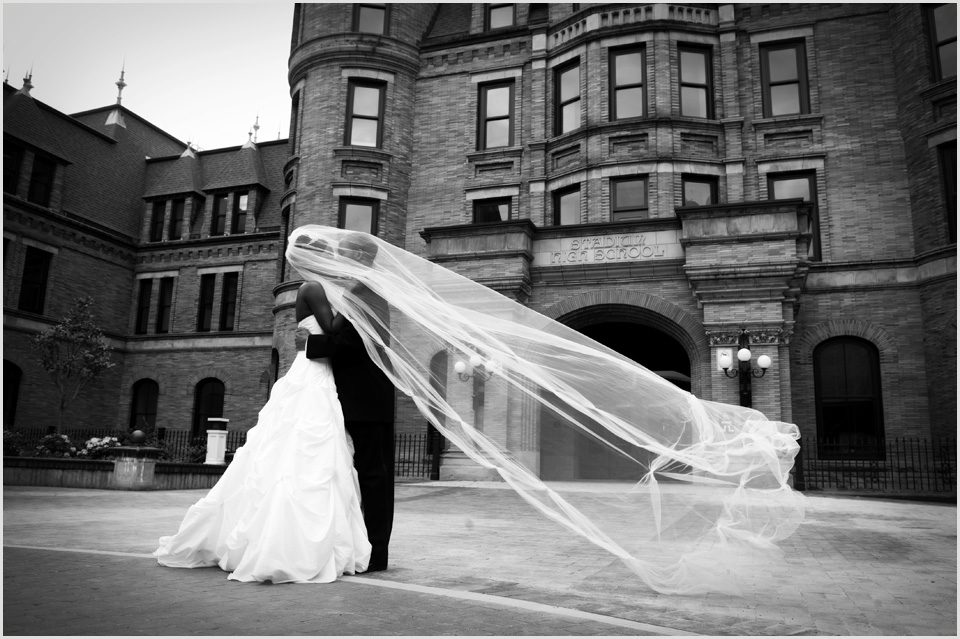 brides long veil blows in the wind