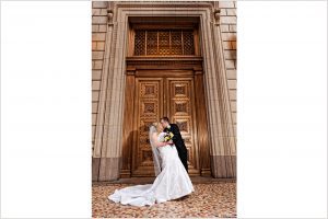 bride and groom outside Treasury downtown portland