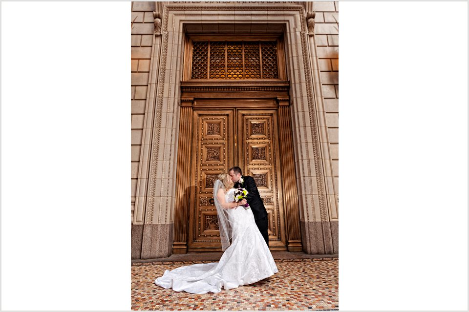 bride and groom outside Treasury downtown portland